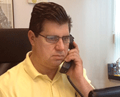 man in office on phone